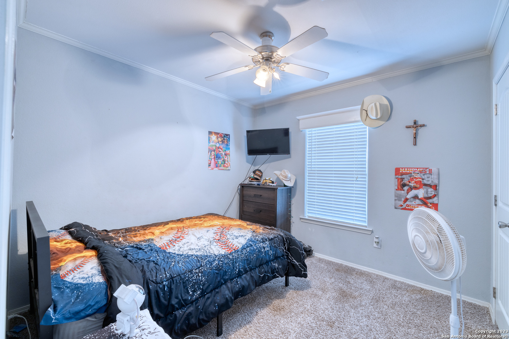 1189 North A Cr Concan, TX 78838 - Photo 58 of 68 a bedroom with a bed and a chandelier