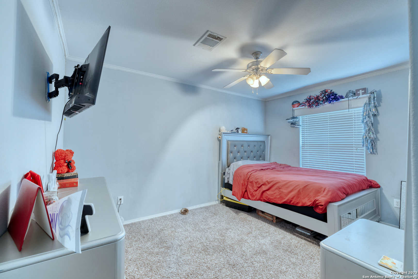 1189 North A Cr Concan, TX 78838 - Photo 60 of 68 a bedroom with a bed and a chandelier