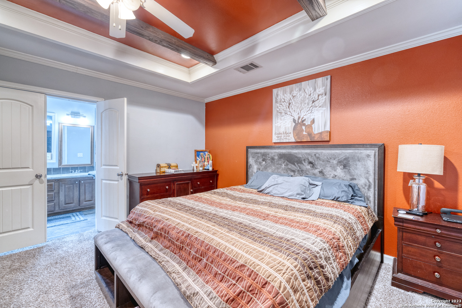 1189 North A Cr Concan, TX 78838 - Photo 62 of 68 a bedroom with a bed and a painting on the wall