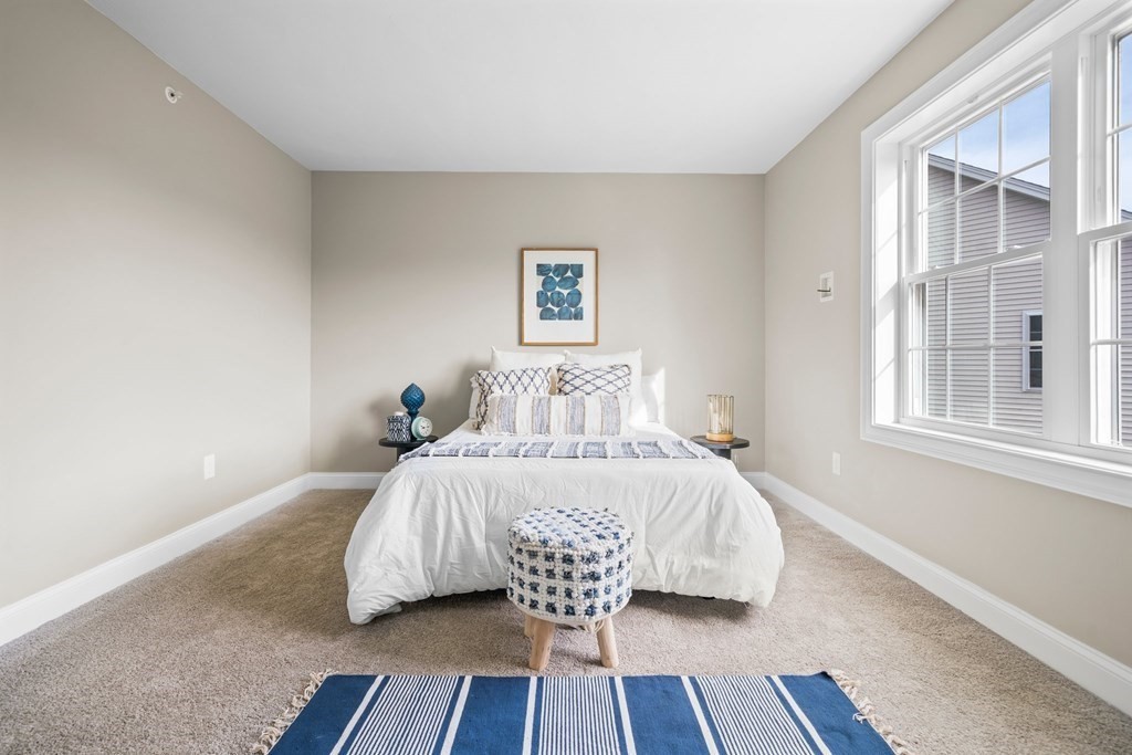 184 Berlin Road Bolton, MA 01740 - Photo 11 of 33 a bed sitting in a bedroom next to a window