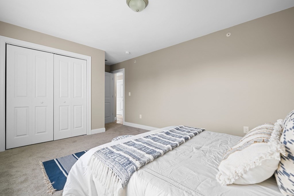 184 Berlin Road Bolton, MA 01740 - Photo 12 of 33 a bedroom with a bed and pillows