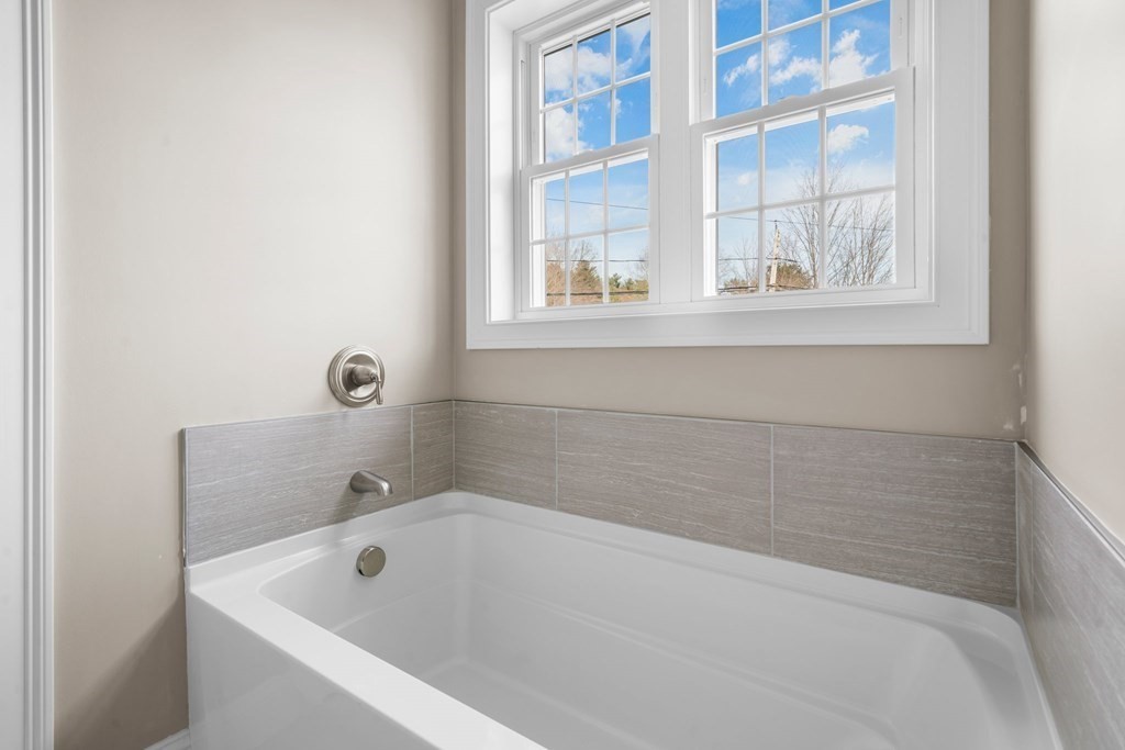 184 Berlin Road Bolton, MA 01740 - Photo 17 of 33 a bath tub sitting next to a window