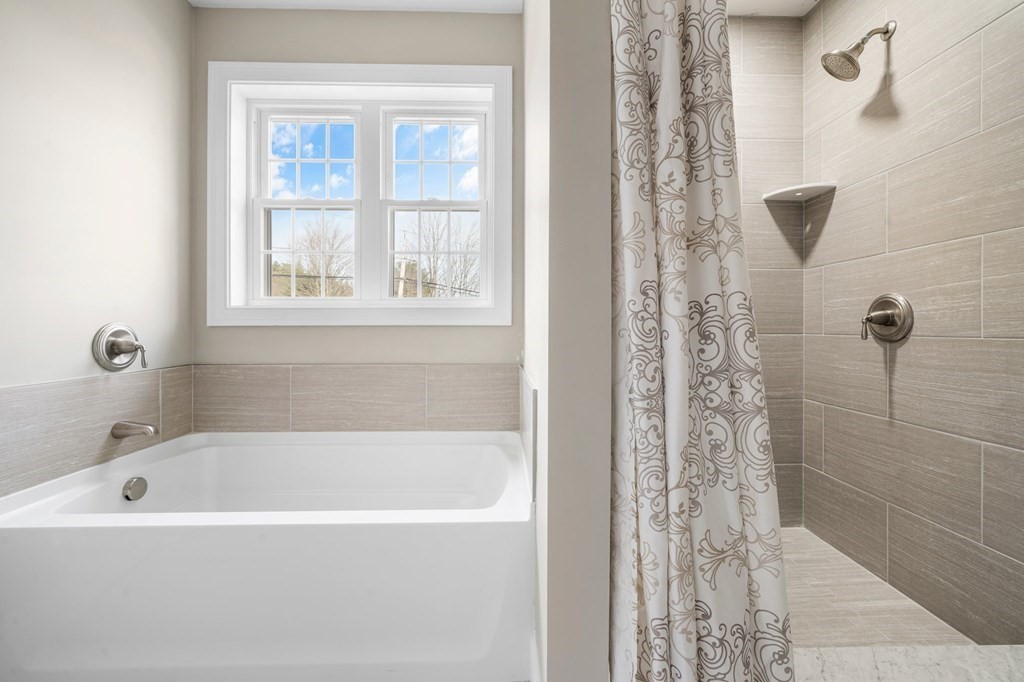 184 Berlin Road Bolton, MA 01740 - Photo 18 of 33 a white bath tub sitting next to a window