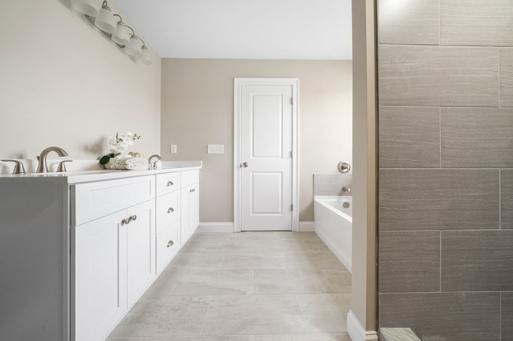 184 Berlin Road Bolton, MA 01740 - Photo 19 of 33 a large bathroom with a double vanity sink a toilet and a shower