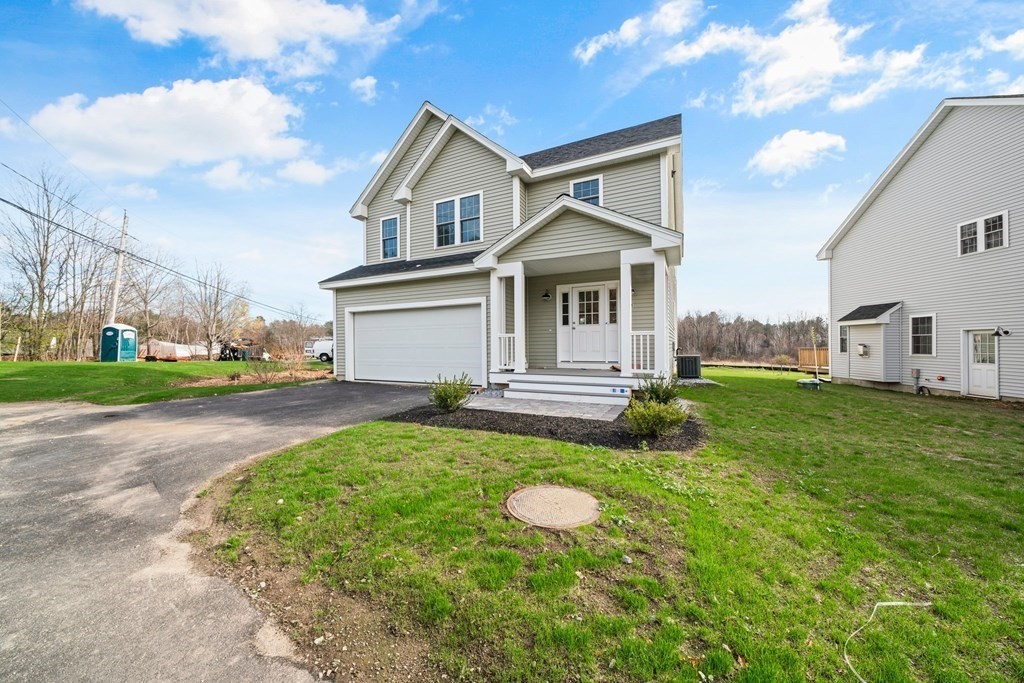 184 Berlin Road Bolton, MA 01740 - Photo 20 of 33 a front view of a house with garden