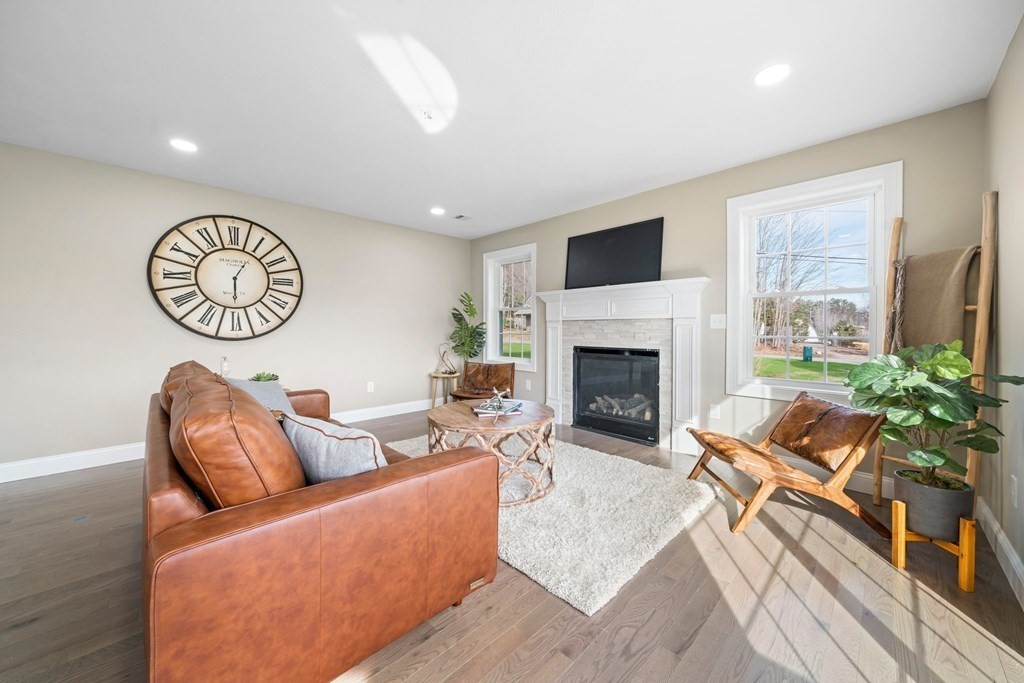 184 Berlin Road Bolton, MA 01740 - Photo 27 of 33 a living room with furniture fireplace and a large window