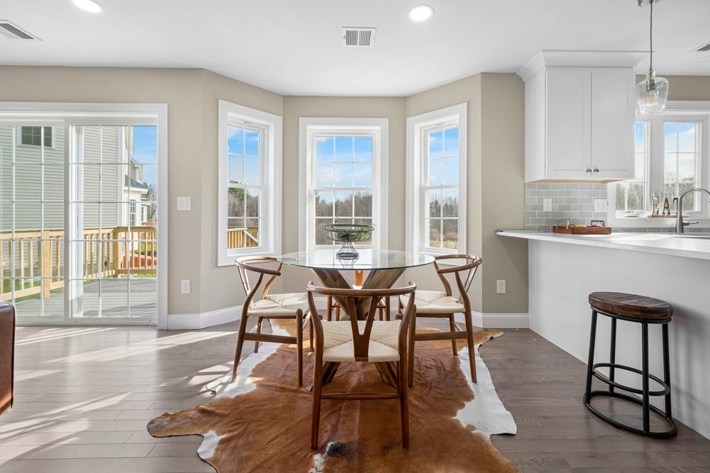 184 Berlin Road Bolton, MA 01740 - Photo 28 of 33 a view of a dining room with furniture window and wooden floor