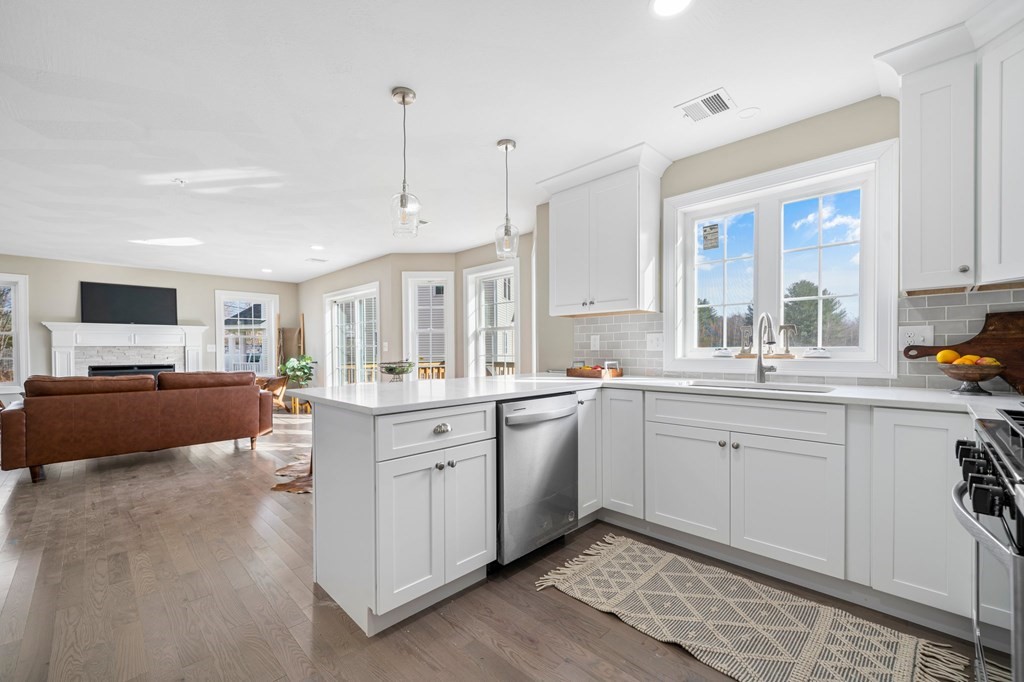 184 Berlin Road Bolton, MA 01740 - Photo 29 of 33 a large white kitchen with a window