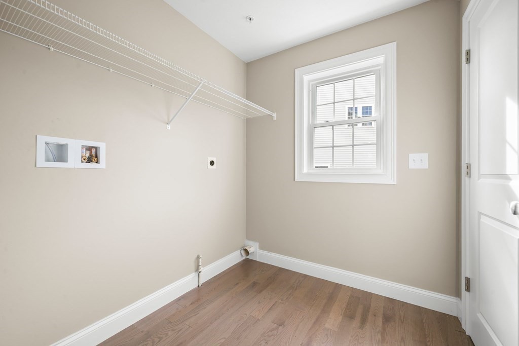 184 Berlin Road Bolton, MA 01740 - Photo 5 of 33 an empty room with a window and wooden floor