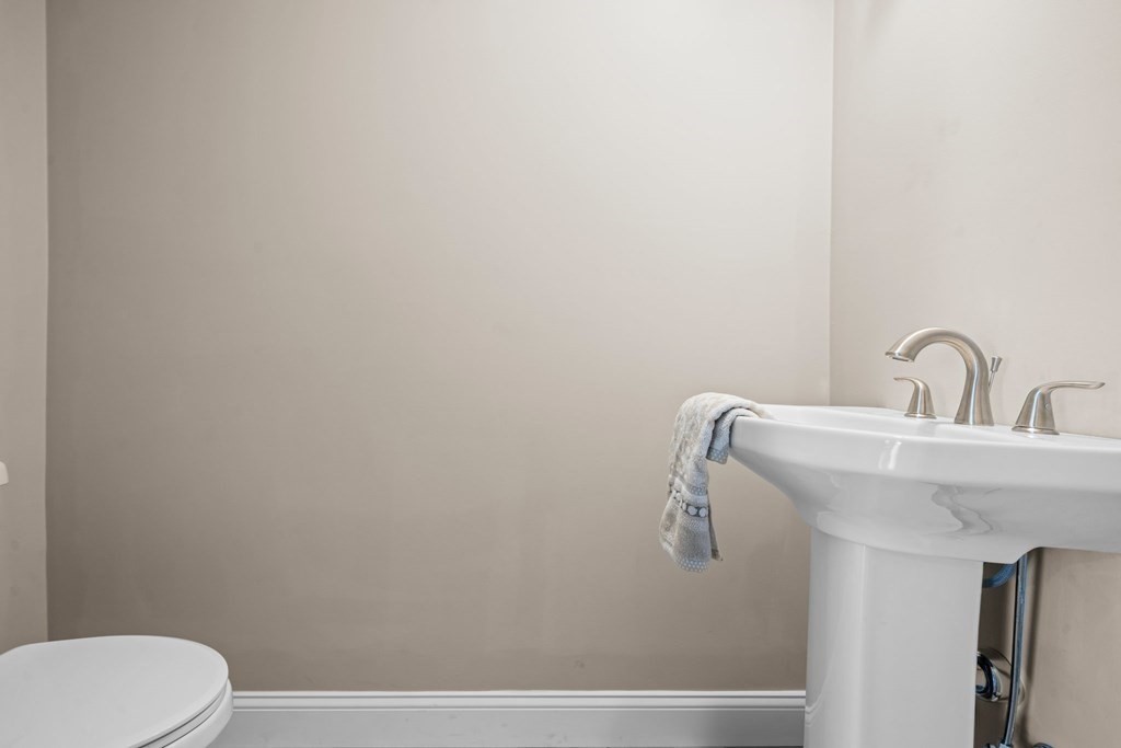 184 Berlin Road Bolton, MA 01740 - Photo 6 of 33 a bathroom with a toilet sink and mirror