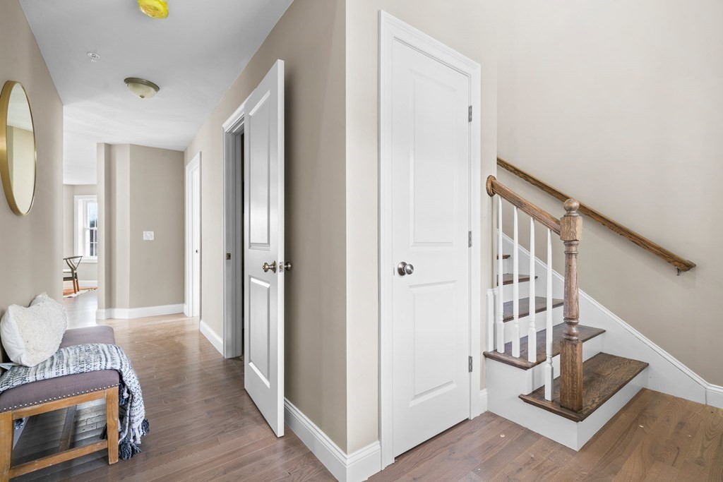 184 Berlin Road Bolton, MA 01740 - Photo 7 of 33 a view of a hallway with furniture and wooden floor