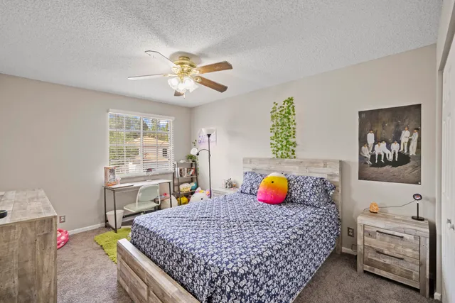 a bedroom with a bed and a table in it