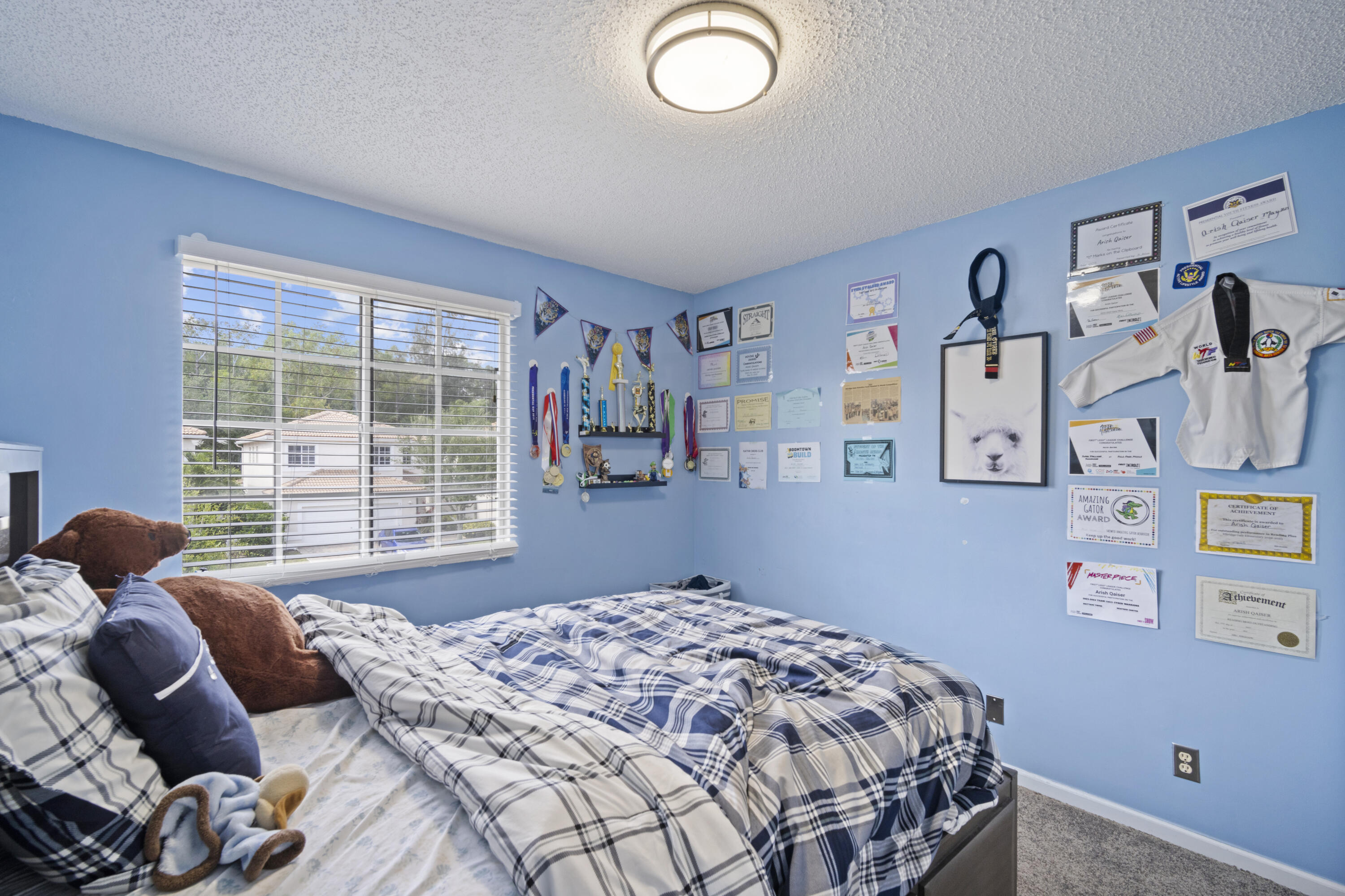 6427 Adriatic Way Greenacres, FL 33413 - Photo 18 of 33 a bedroom with a bed and a window