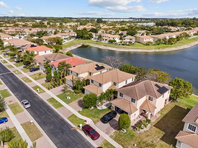 an aerial view of residential houses with outdoor space
