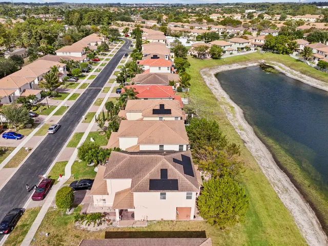 an aerial view of residential houses with outdoor space