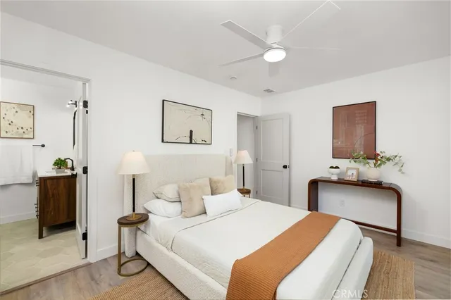 a bedroom with a bed and a couch