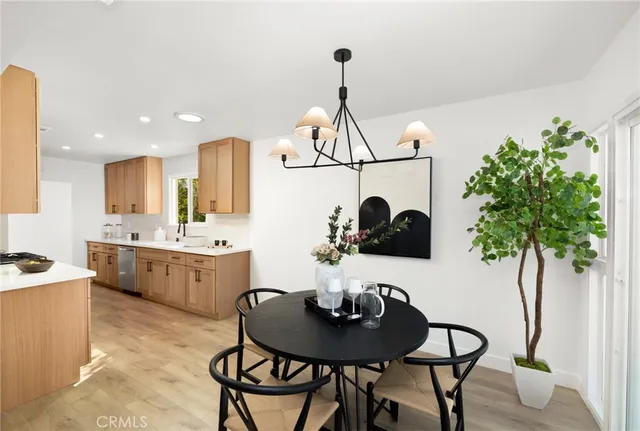 a kitchen with a table and chairs in it