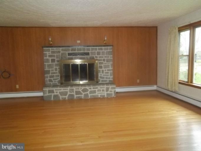 171 Rock Springs Road Conowingo, MD 21918 - Photo 9 of 17 RAISED HEARTH GRANITE FIREPLACE