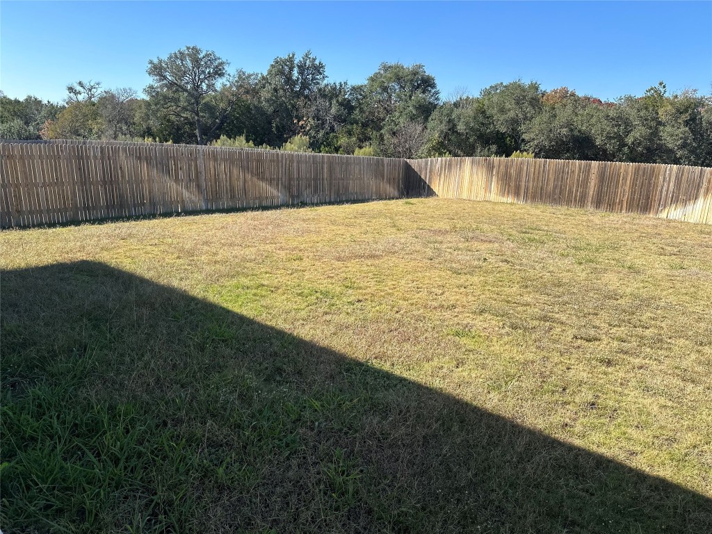 241 Deserti Road Leander, TX 78641 - Photo 19 of 24 a swimming pool with wooden fence