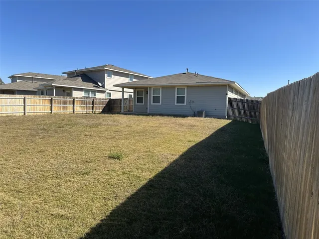 a front view of a house with yard