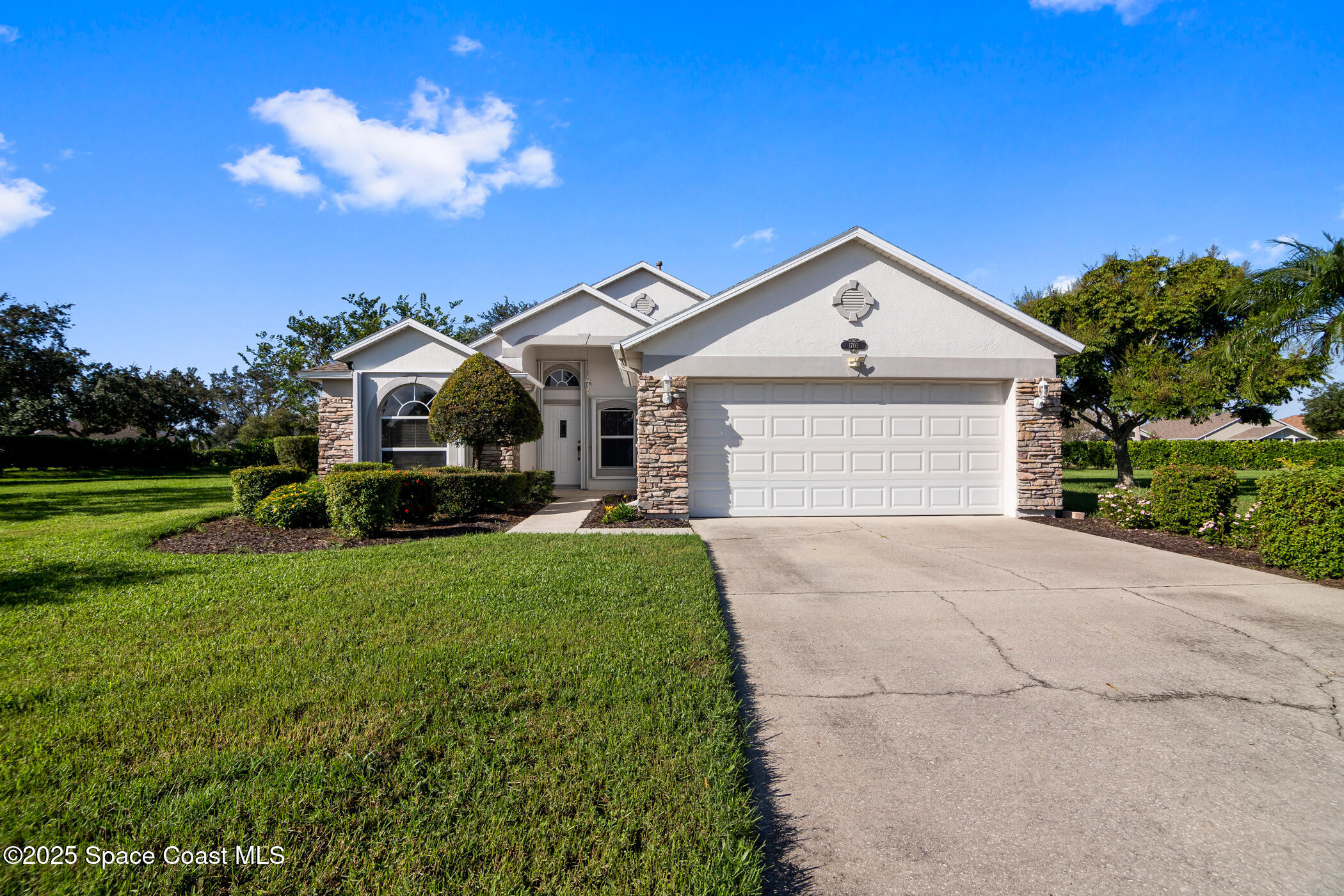 1703 Keys Gate Drive Melbourne, FL 32940 - Photo 2 of 44 a front view of a house with yard