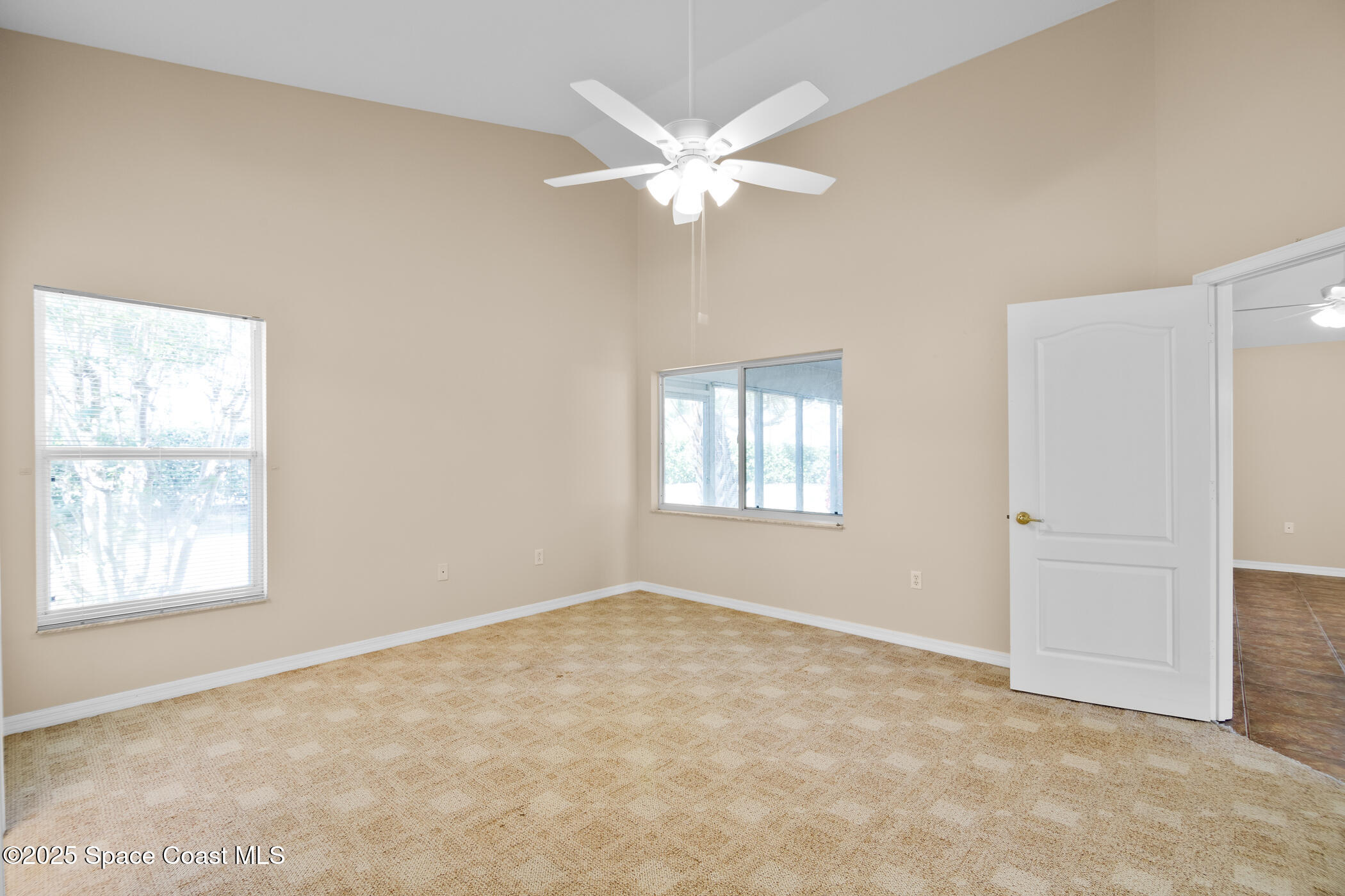 1703 Keys Gate Drive Melbourne, FL 32940 - Photo 26 of 44 a view of an empty room with a window