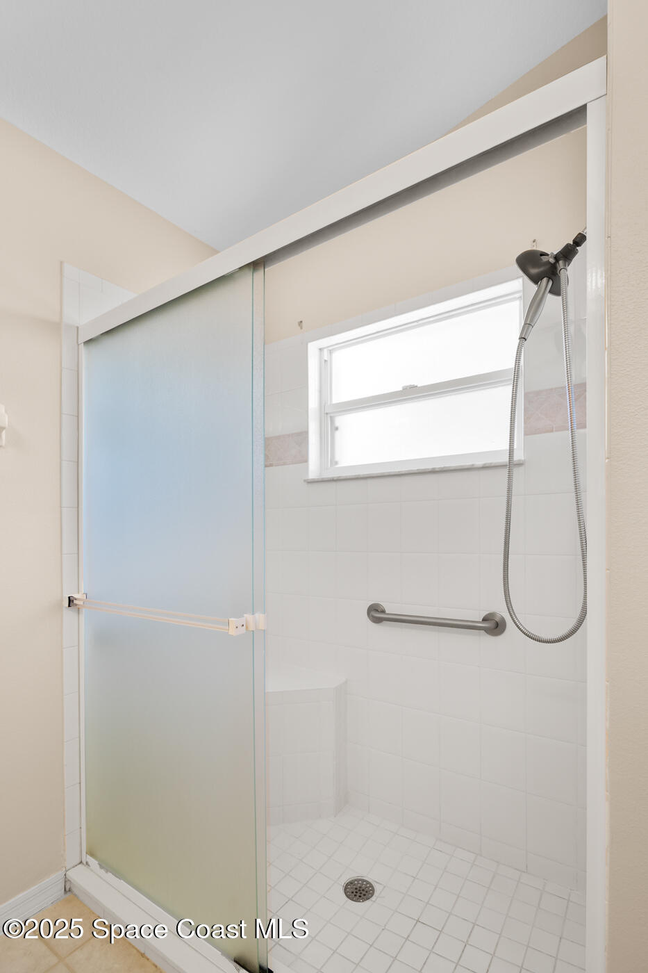 1703 Keys Gate Drive Melbourne, FL 32940 - Photo 29 of 44 a bathroom with a glass shower door