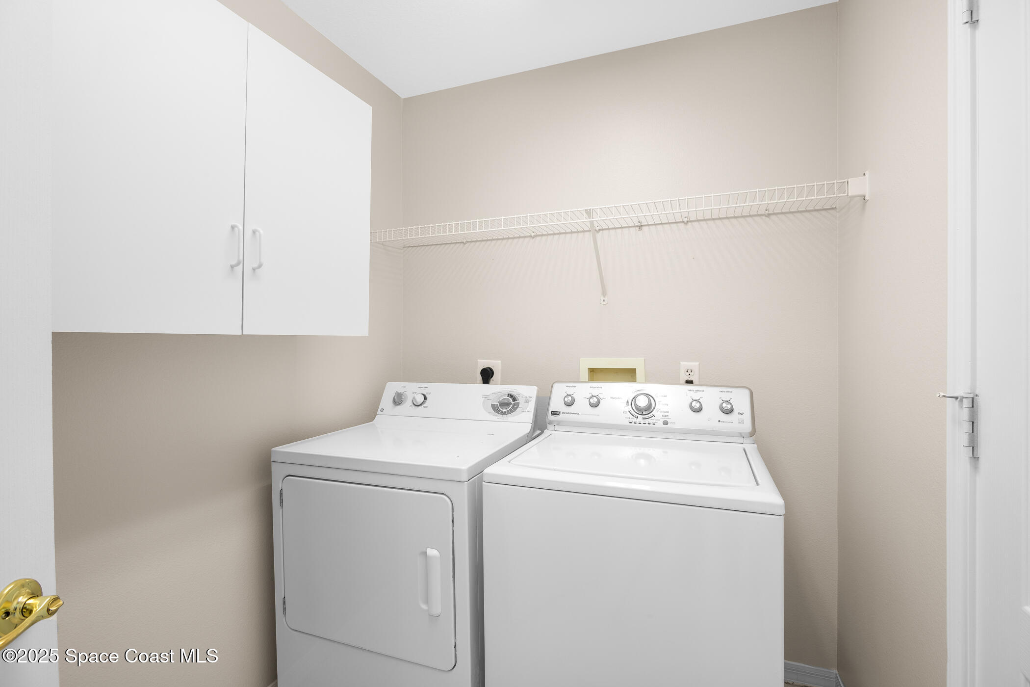 1703 Keys Gate Drive Melbourne, FL 32940 - Photo 8 of 44 a utility room with dryer and washer