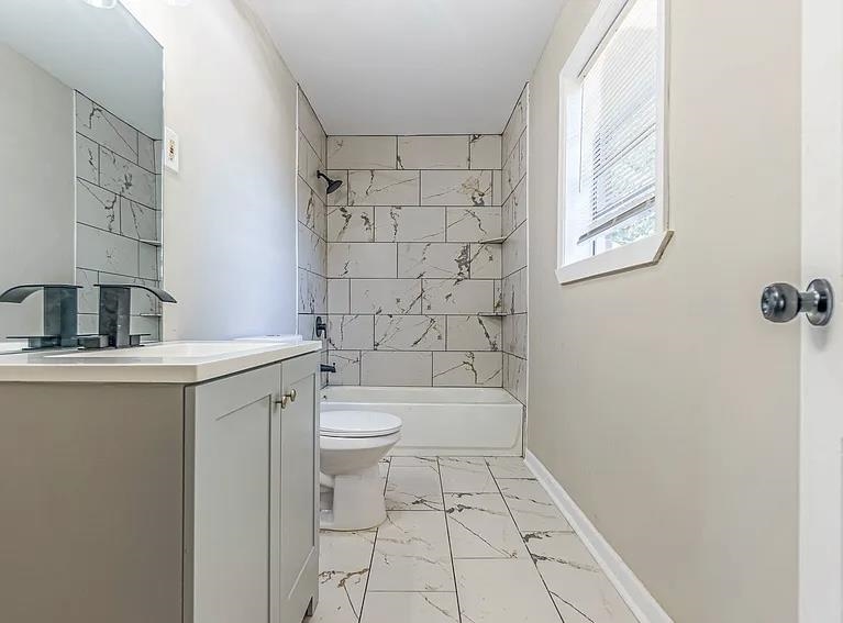 96 Modder Avenue Memphis, TN 38109 - Photo 11 of 12 a bathroom with a sink a toilet and shower