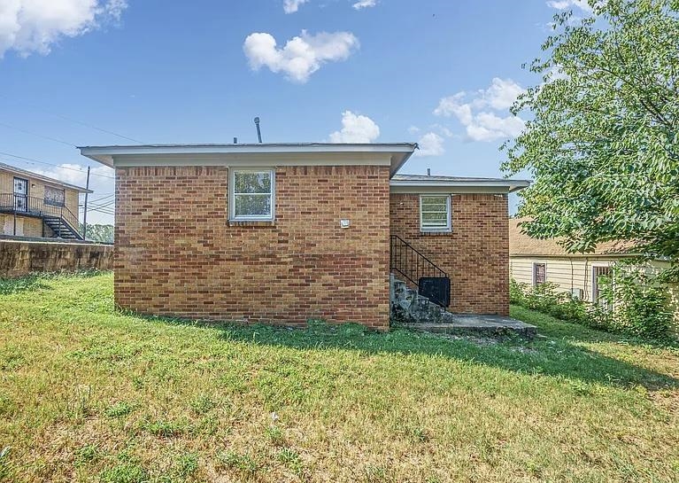 96 Modder Avenue Memphis, TN 38109 - Photo 12 of 12 a front view of a house with a garden