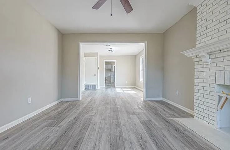 96 Modder Avenue Memphis, TN 38109 - Photo 3 of 12 wooden floor in an empty room with a window