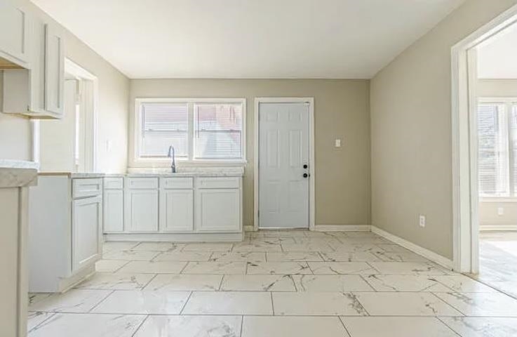 96 Modder Avenue Memphis, TN 38109 - Photo 7 of 12 a view of a kitchen with white cabinets