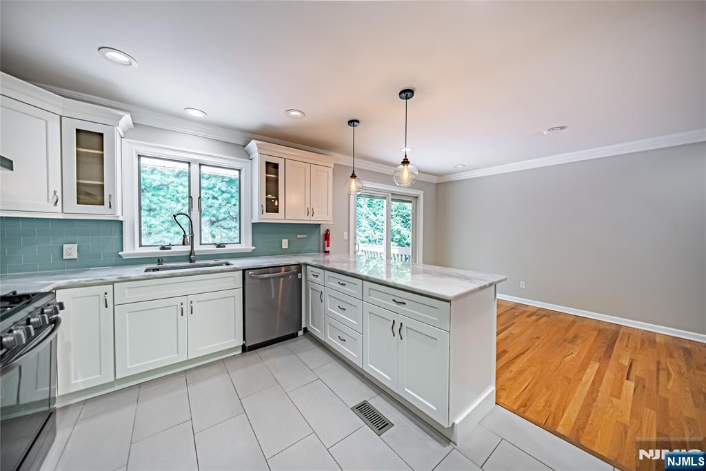 71 Columbus Road Demarest, NJ 07627 - Photo 13 of 50 a kitchen with a sink window and cabinets
