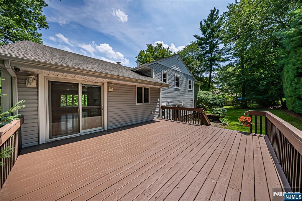 71 Columbus Road Demarest, NJ 07627 - Photo 16 of 50 a house with yard and a garden