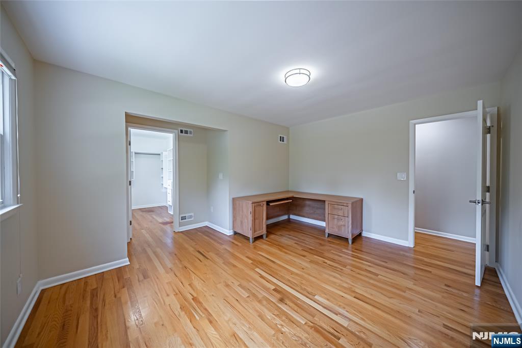 71 Columbus Road Demarest, NJ 07627 - Photo 23 of 50 a bedroom with a bed and a table