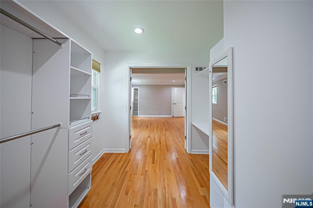 71 Columbus Road Demarest, NJ 07627 - Photo 24 of 50 a view of walk in closet with wooden floor