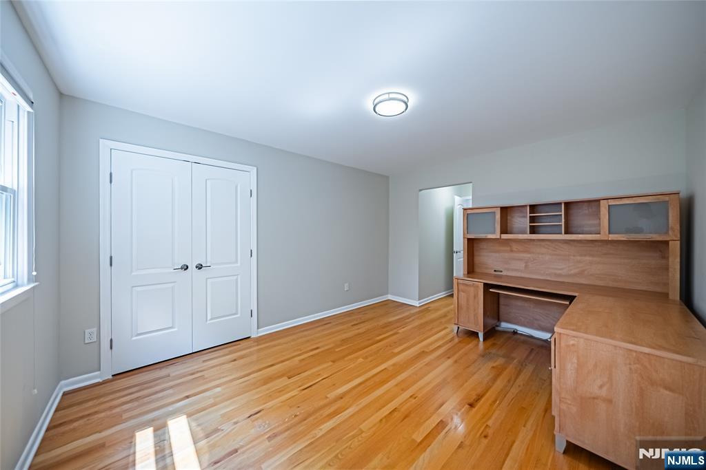 71 Columbus Road Demarest, NJ 07627 - Photo 32 of 50 a bedroom with a bed and wooden floor