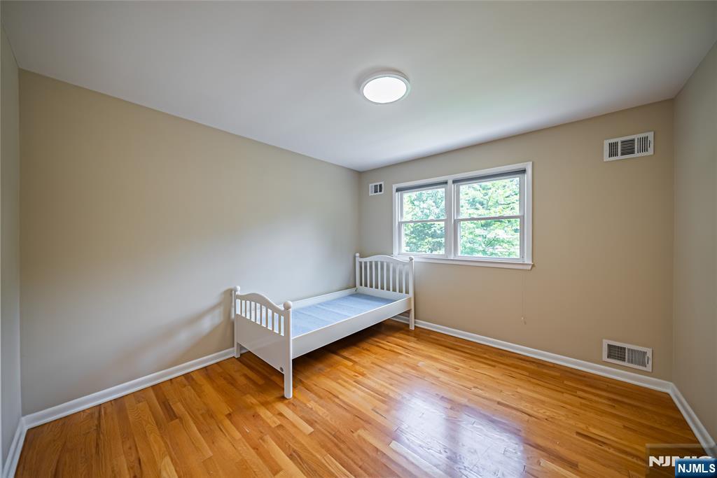 71 Columbus Road Demarest, NJ 07627 - Photo 36 of 50 a room with a bed and a window