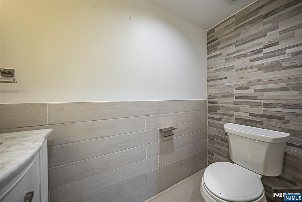 71 Columbus Road Demarest, NJ 07627 - Photo 42 of 50 a white toilet sitting next to a shower