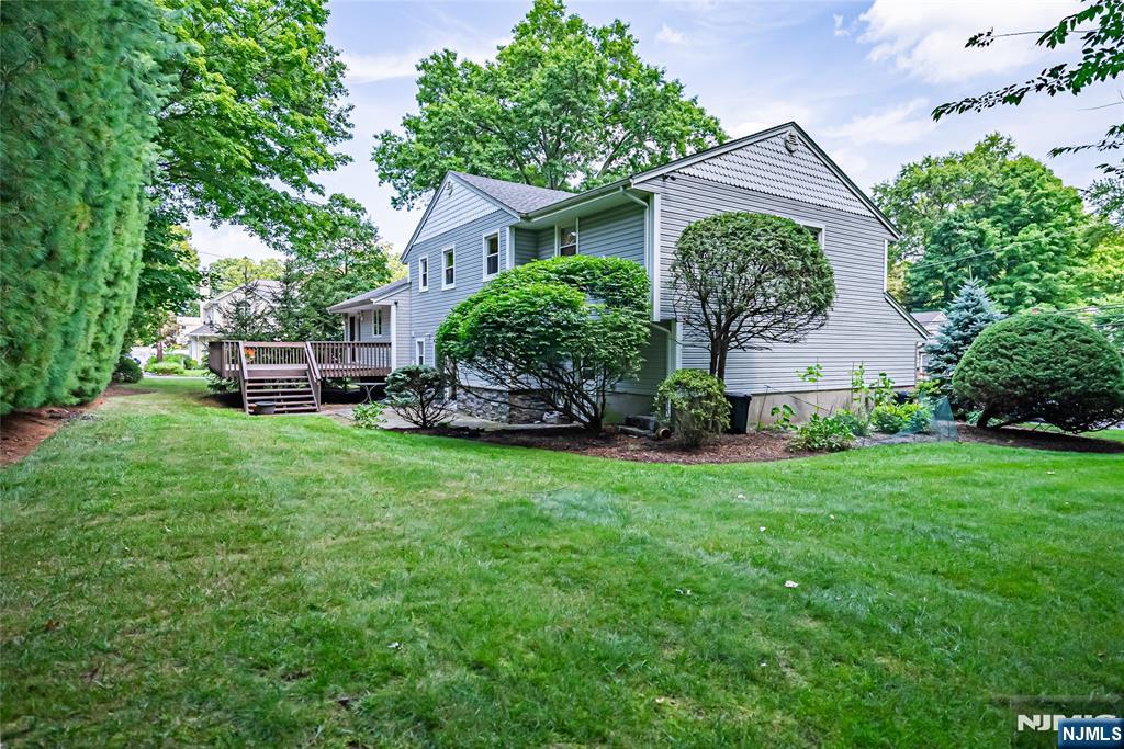 71 Columbus Road Demarest, NJ 07627 - Photo 49 of 50 a front view of a house with garden