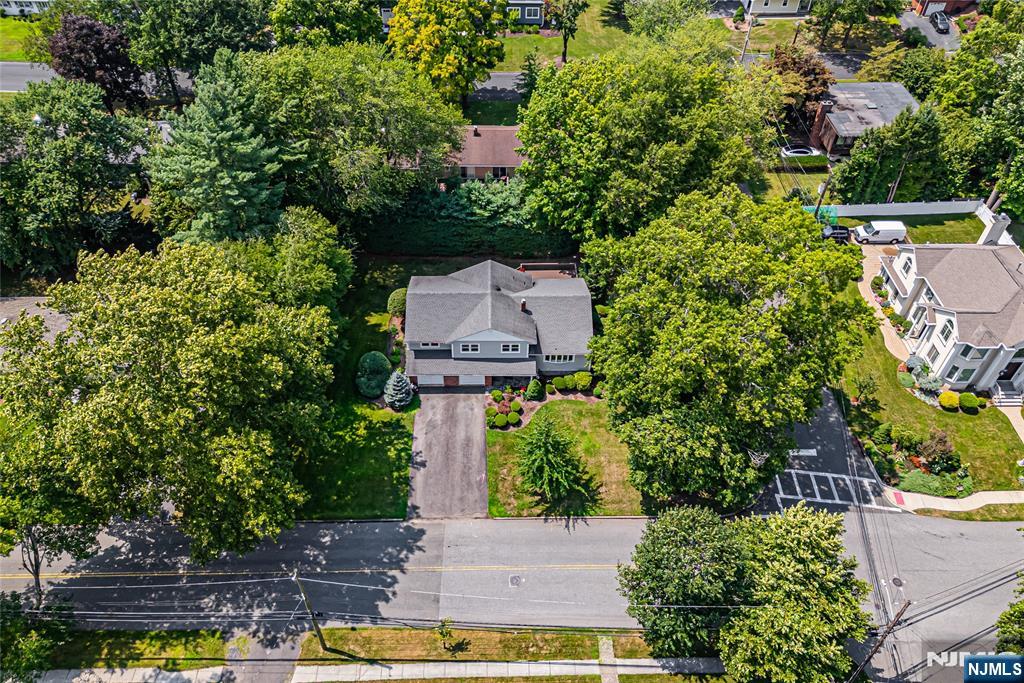 71 Columbus Road Demarest, NJ 07627 - Photo 50 of 50 an aerial view of a house with swimming pool outdoor seating and yard
