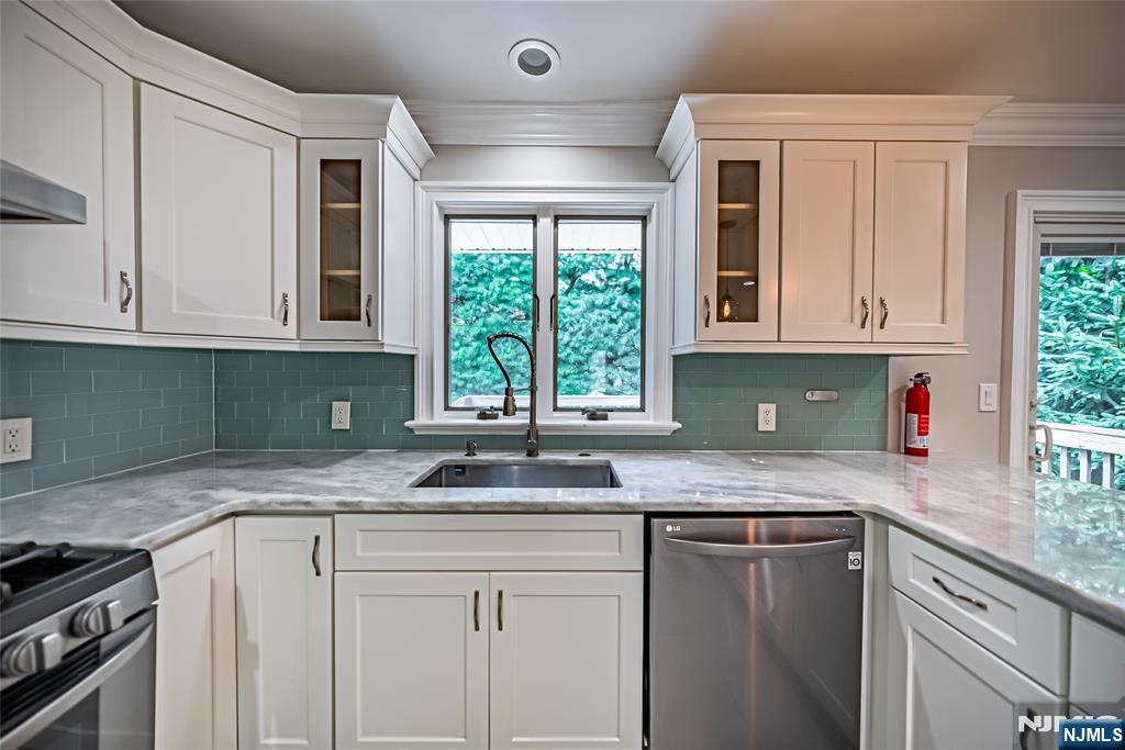 71 Columbus Road Demarest, NJ 07627 - Photo 10 of 50 a kitchen with granite countertop cabinets stainless steel appliances a sink and window