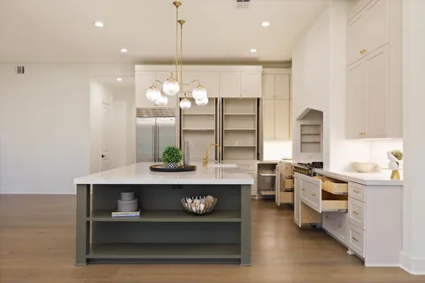 a open kitchen with stainless steel appliances granite countertop a stove and cabinets