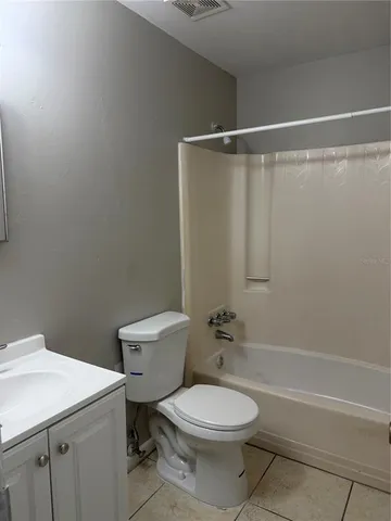 a bathroom with a toilet a sink and a shower
