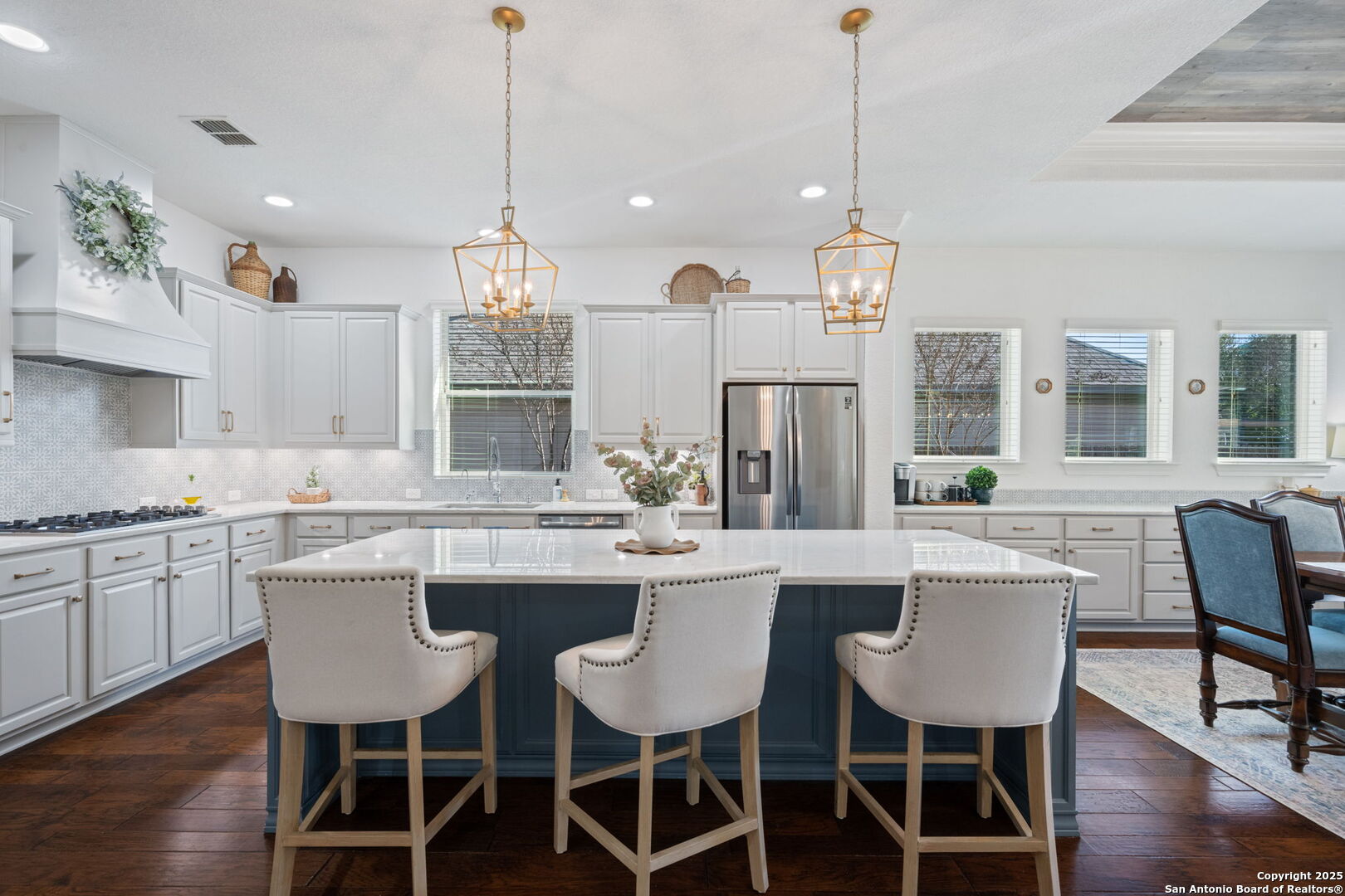 28827 Pfeiffers Gate Fair Oaks Ranch, TX 78015 - Photo 16 of 36 a view of a dining room and chandelier furniture with wooden floor and chandelier