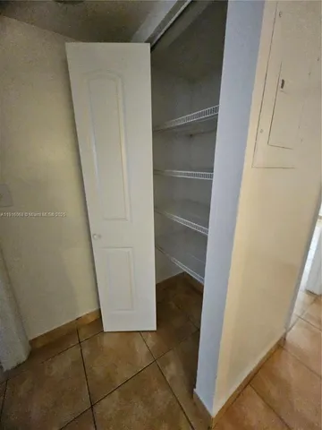 a view of an empty room with windows