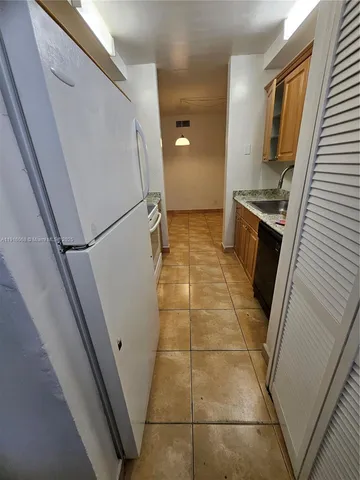 a bathroom with a sink a toilet and a shower