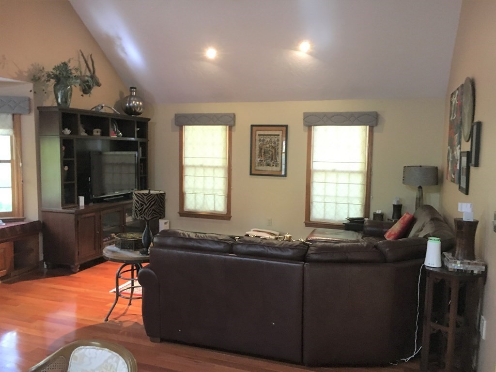 9 Virginia Ridge Road Sudbury, MA 01776 - Photo 12 of 40 a living room with furniture and a flat screen tv