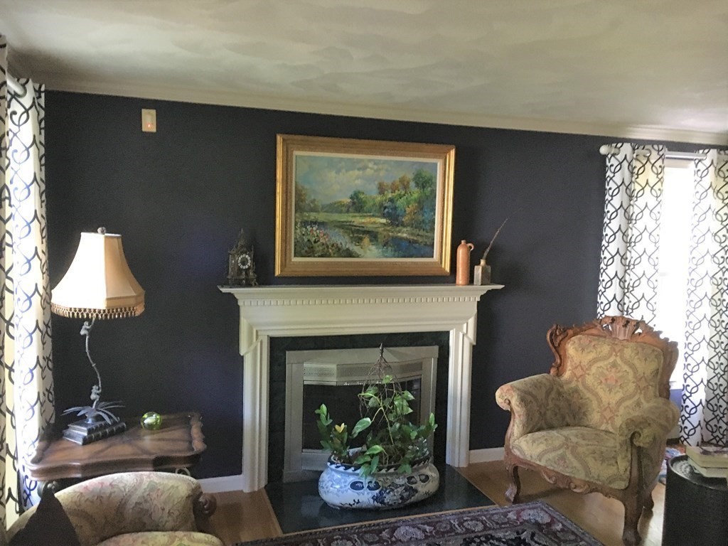 9 Virginia Ridge Road Sudbury, MA 01776 - Photo 14 of 40 a living room with furniture and a fireplace