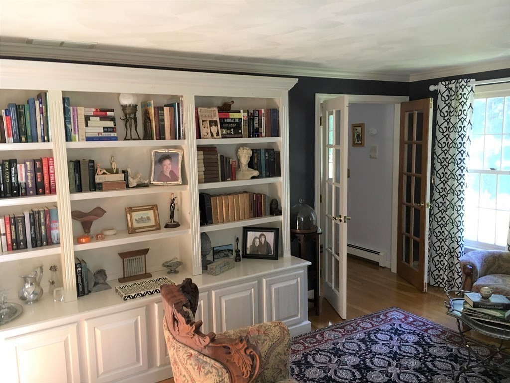 9 Virginia Ridge Road Sudbury, MA 01776 - Photo 15 of 40 a bedroom with furniture and a book shelf